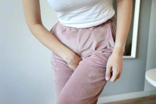 older woman running to the toilet because of urinary incontinence Birkenhead
